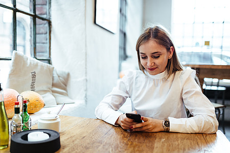 Pretty blonde woman sitting in the cafe thumbnail