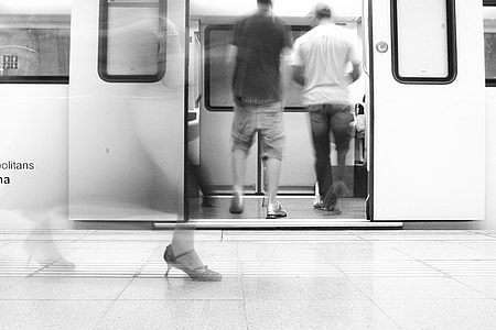 grayscale photography of two men inside subway thumbnail