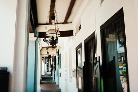 white and black chimes hanging on patio thumbnail