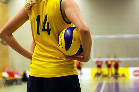 macro shot photography of volleyball player holding ball thumbnail