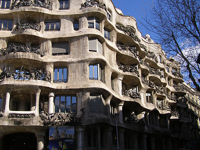 brown concrete building under blue clear sky during daytime thumbnail