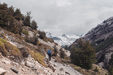 person standing on brown soil during daytime thumbnail
