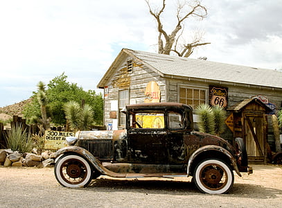 photography of black Ford Model A near gray house thumbnail