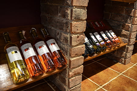 assorted-brand wine bottles on shelf thumbnail