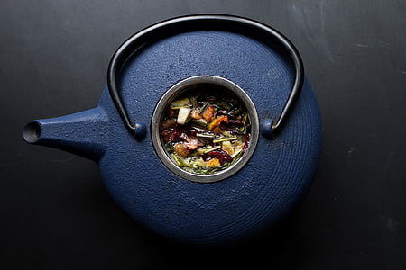 blue teapot filled with herbs thumbnail