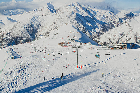 aerial photo of group of people standing on snowy ground thumbnail