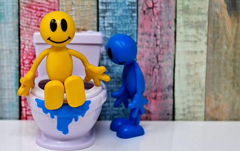 yellow and white figure on white surface thumbnail