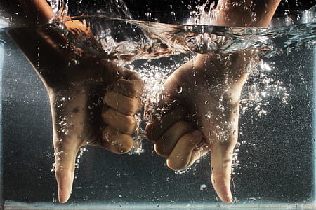 two hands on body of water thumbnail