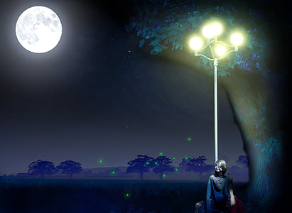 woman standing beside lamp post during nighttime thumbnail