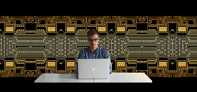 man sitting while using MacBook thumbnail