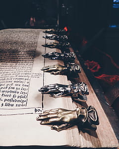 Close Up Photo of Black and Brown Metal Hand Book Mark thumbnail