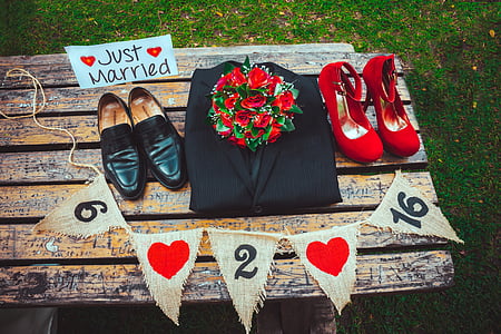 pairs of loafers and pumps on wooden table thumbnail