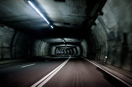 gray concrete empty road inside tunnel thumbnail
