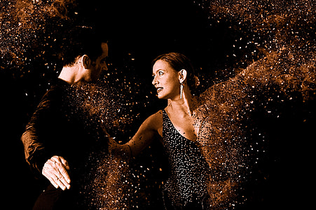 men's black long-sleeved shirt facing woman dancing thumbnail