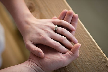 person putting hand over another's hand thumbnail