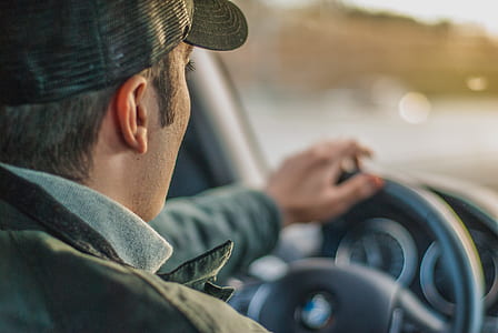 man holding steering wheel thumbnail