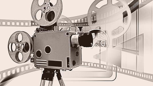 gray reel-to-reel projector against gray background thumbnail