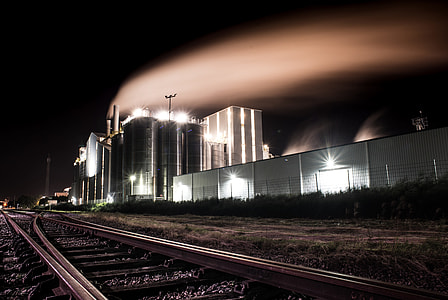 photography of black high-rise building at night time thumbnail
