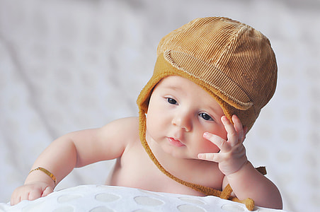 Young baby wearing hat thumbnail