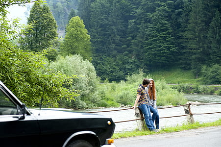 Man and Woman Sitting on Road Gutter thumbnail