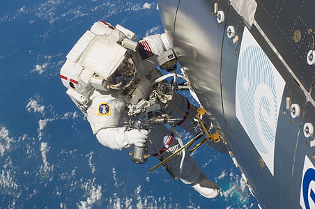 astronaut outside space station thumbnail