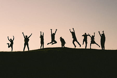 nine persons silhouette of jumping during golden hour thumbnail