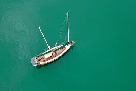 White Sailing Boat on Body of Water thumbnail