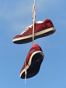 pair of red-and-white low-top sneakers thumbnail