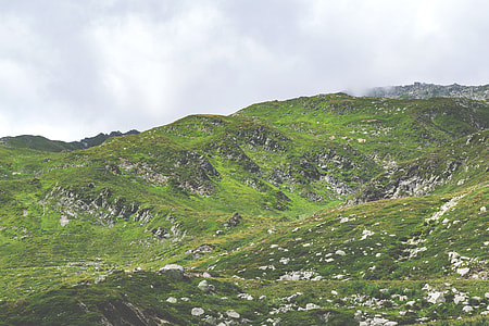 low-angle photo of mountain with green grass thumbnail