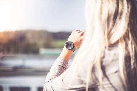 Young Woman with Gray Fashion Watches Enjoying Views thumbnail