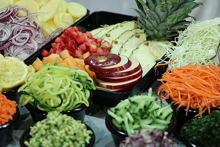 sliced vegetable and fruits in bowls and dishes thumbnail
