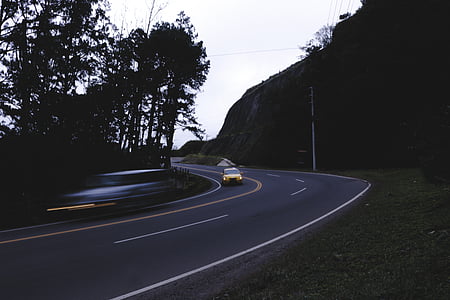 yellow vehicle on gray concrete road thumbnail