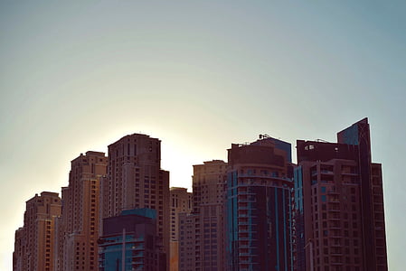 high rise building under gray sky thumbnail
