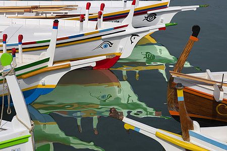 brown and white wooden boats thumbnail