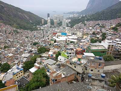 aerial photo of city on valley near body of water thumbnail