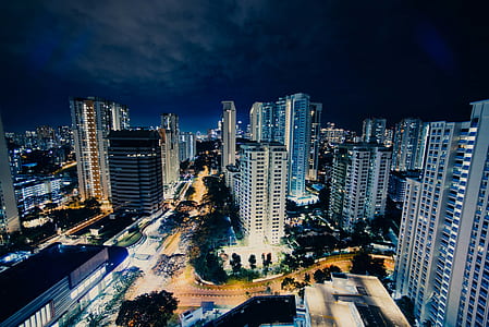 time lapse photography of passing cars on lighted city skyline thumbnail