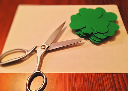 scissors near green paper cutout flowers thumbnail