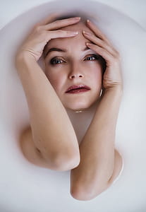woman with red lipstick taking a bath thumbnail