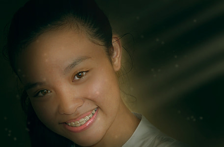 smiling girl wearing white shirt thumbnail