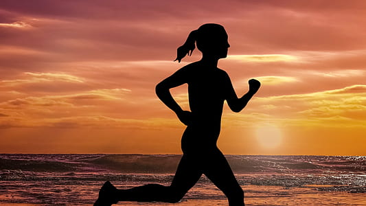 silhouette of woman running on seashore thumbnail