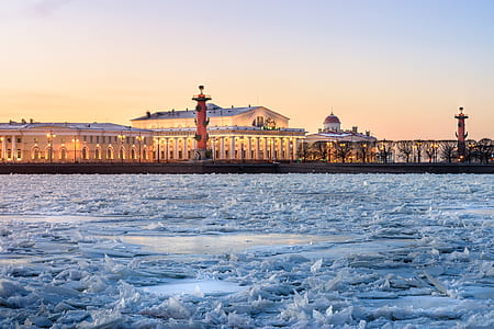 white concrete building near ice formation thumbnail