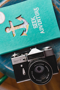 Blue notebooks and a camera on a blue wooden stool thumbnail