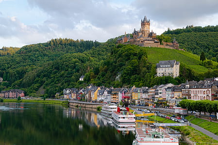 landscape photograph of houses near body of water thumbnail