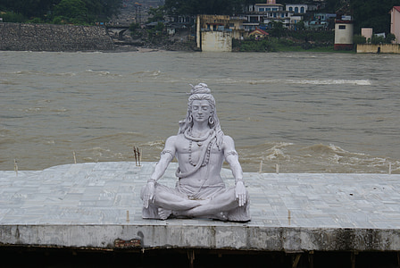 male statue near body of water thumbnail
