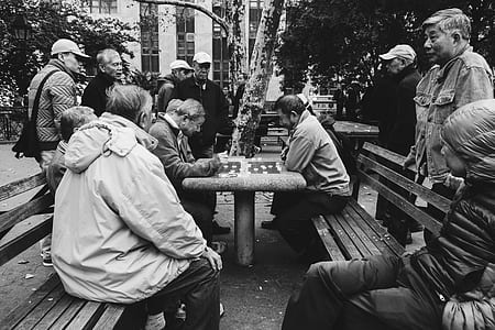 grayscale photography of two person playing board game thumbnail