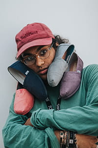four Toms shoes on person's shoulder thumbnail