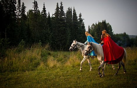two women riding white horses thumbnail