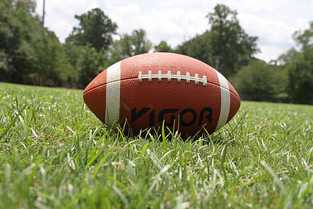 Vigor football pigskin on grass field thumbnail