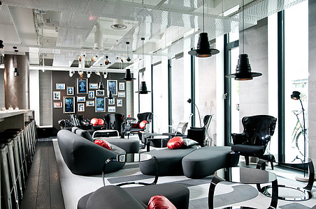 black chairs and sofa near table thumbnail