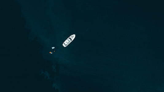 birdseye photography of white powerboat thumbnail